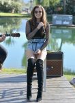 Hailee Steinfeld sexy wearing denim shorts and black boots