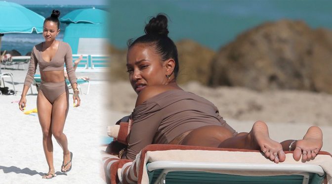 Karrueche Tran wearing a tankini on a beach in Miami