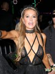 Paris Hilton exposing her breasts going braless in sheer black top