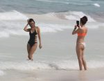 Victoria Justice in a swimsuit with friends at a beach in Cancun