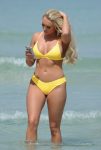 Amber Turner cameltoe in a yellow skimpy bikini on holiday in Dubai