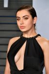 Charli Xcx sexy boobs in low-cut revealing dress at Oscar party