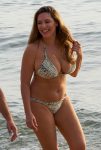 Kelly Brook show off her huge breasts wearing bikini