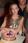 Lindsay Lohan giving glimpse of her big boobs in tight short dress