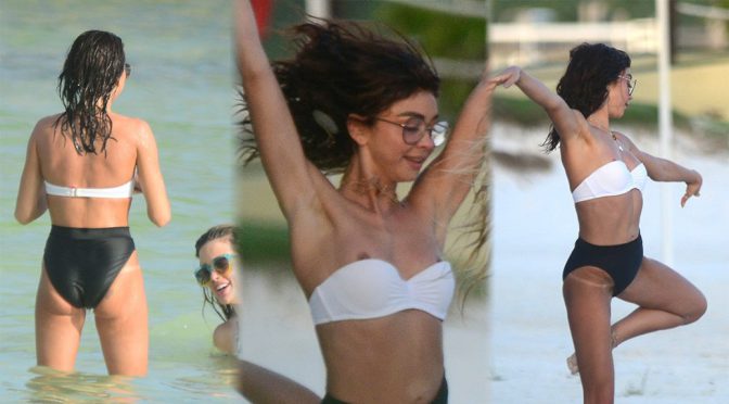 Sarah Hyland – Sexy Nip-Slip in Tiny Bikini on the Beach in Cancun
