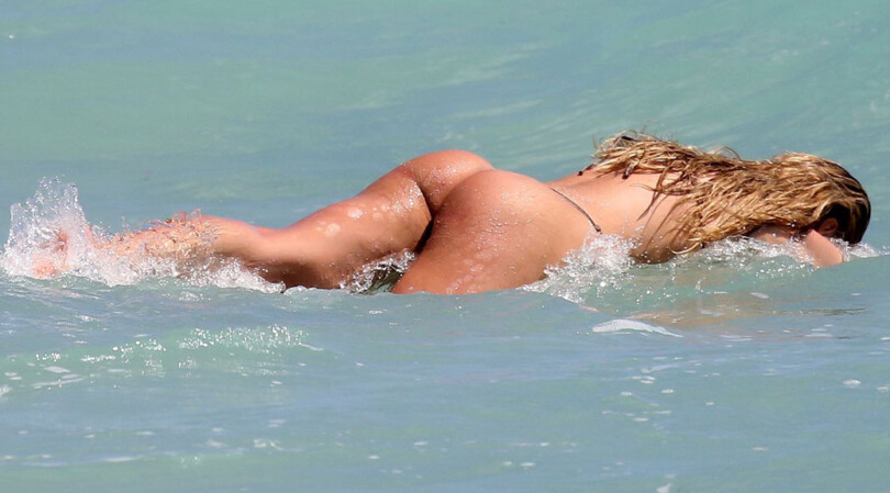 Candice Swanepoel – Beautiful Ass in Tiny Thong Bikini on the Beach in Miami