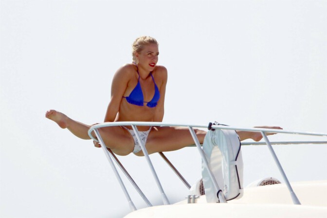 Gabby Allen show off her fit body wearing small bikini as she enjoys a day by the sea with friends in Ibiza.