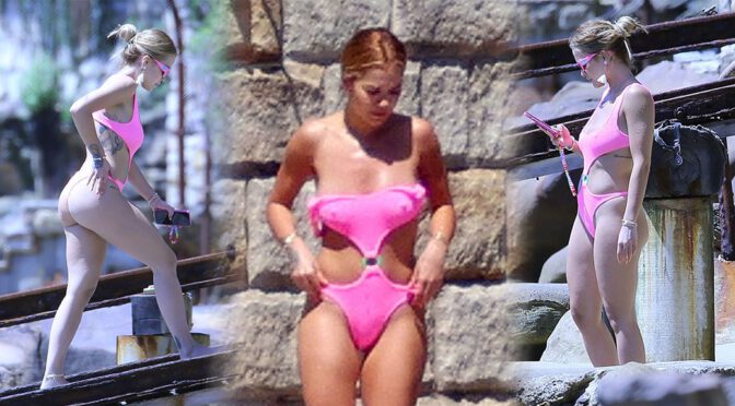 Rita Ora – Sexy Body and Pokies in a Pink Swimsuit in Sydney