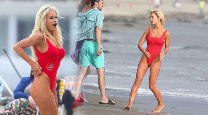 Lily James – Big Boobs in a Red Swimsuit on a Beach in Malibu