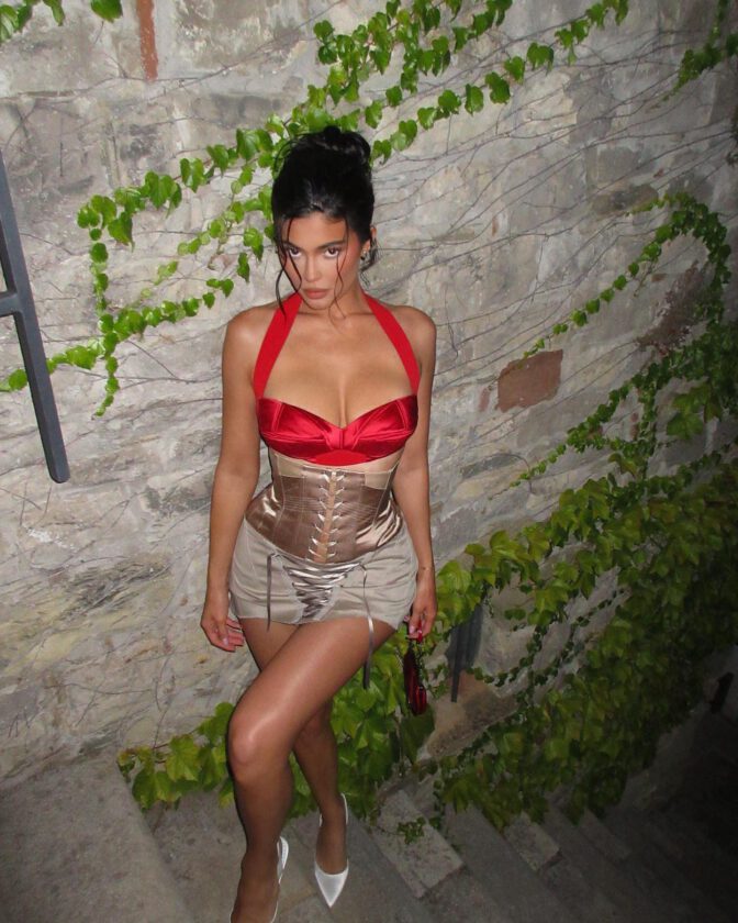Kylie Jenner Oozes Confidence In A Red Top, Revealing Captivating Cleavage.