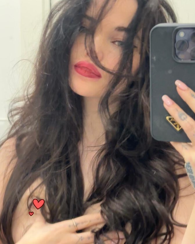 Dove Cameron's Topless Elegance Concealed By A Mesmerizing Flow Of Hair.