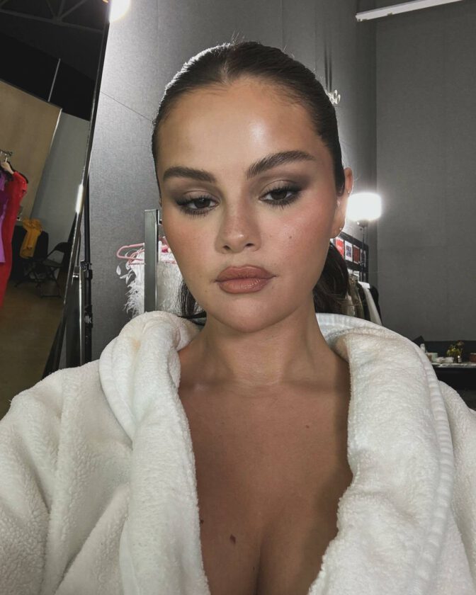 Selena Gomez Sexy White Robe Cleavage Tease