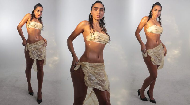 Sommer Ray Barely Covers Her Curves in a See-Through Gold Wrap