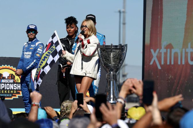 Sydney Sweeney Sexy Trackside Leather Shorts Bare Thighs