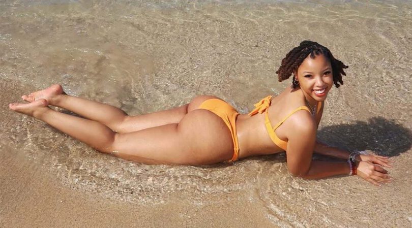 Chloe Bailey’s Beach Booty on Full Display in Orange Bikini