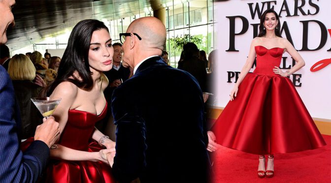 Devil in Red Satin – Anne Hathaway Serves Major Cleavage and Curves on the Red Carpet