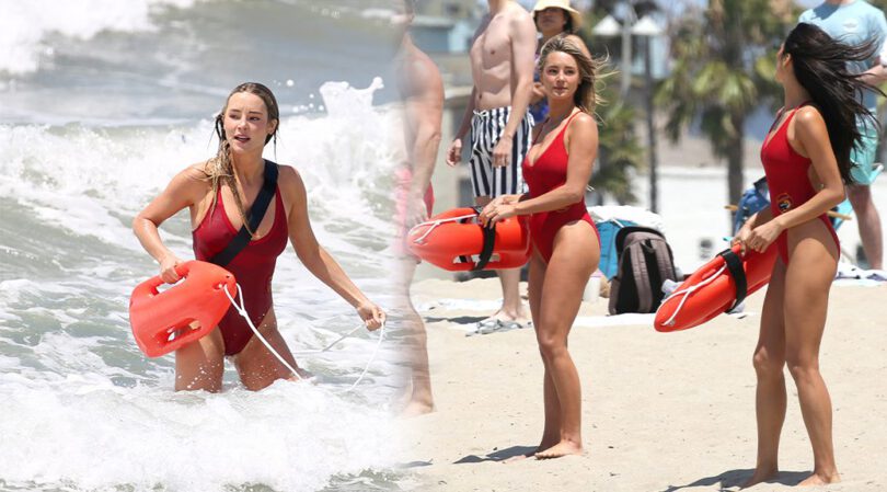 Blonde Bombshell Hassie Harrison Soaks Her Massive Cleavage in Iconic Baywatch One-Piece