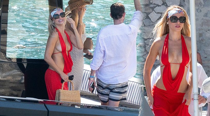 Brooks Nader Barely Restrains Her Boobs Braless in Sizzling Red Dress on Positano Yacht