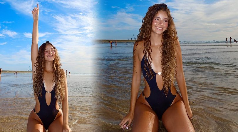 Marta Ferreira Flaunts Sexy Curves in a Dangerously Low-Cut Black Swimsuit