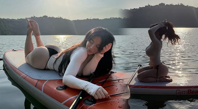 Alexis Mucci Catches Golden Hour on a Paddleboard in a Form-Fitting White Top and Black Thong