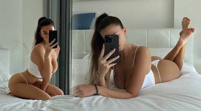 Cristy Ren Spills Out of a Tiny White Tank Top While Showing Off That Round Ass on the Hotel Bed