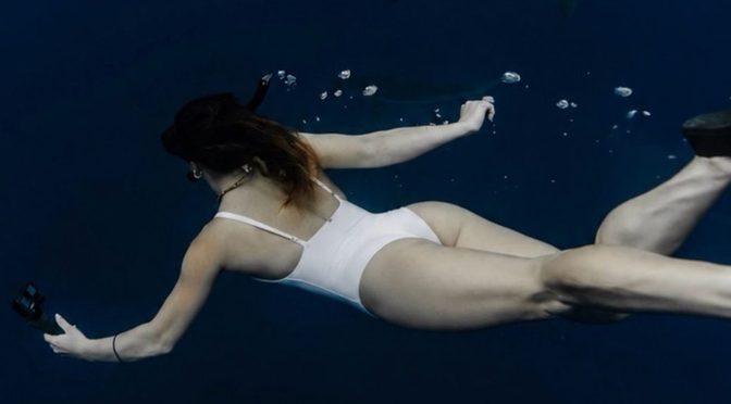 Sofie Dossi Risks It All In A Cheeky White Swimsuit Surrounded By Sharks